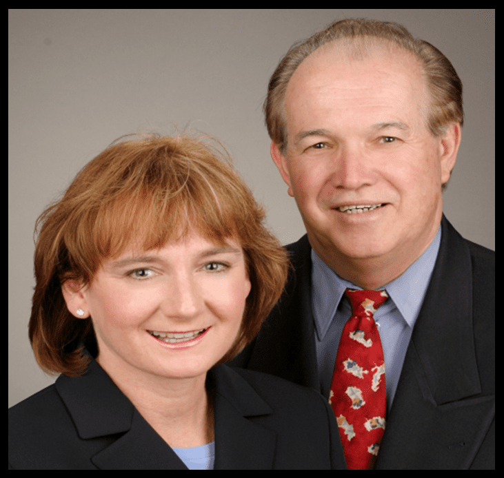 A man and woman standing next to each other.